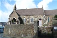 External view of a church purched beside a road