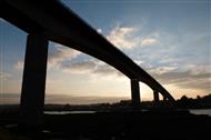 Towering span of a bridge at dusk